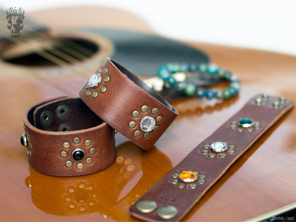 KAAL vintage hippie leather bracelet on guitar