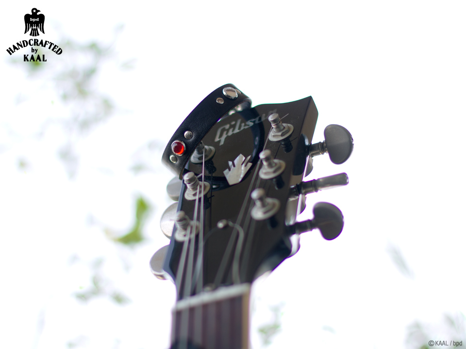 kaal leather bracelet on guitar